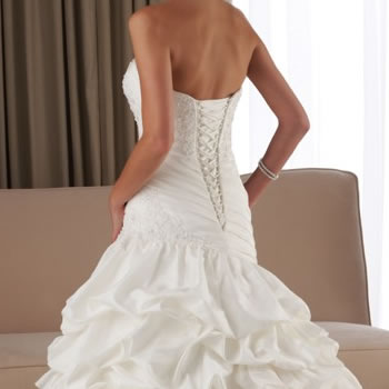 Lace-up back above a ruffled skirt